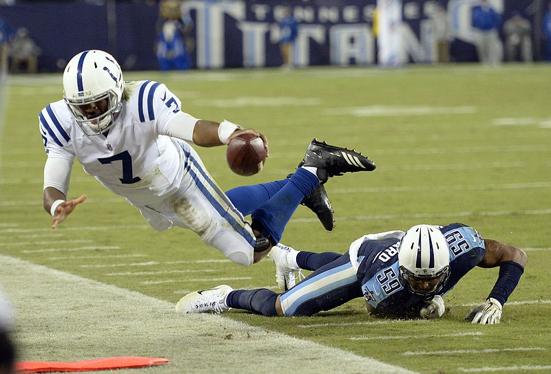 
              Tennessee Titans inside linebacker Wesley Woodyard (59) knocks Indianapolis Colts quarterback Jacoby Brissett (7) out of bounds to stop a Colts' drive late in the fourth quarter of an NFL football game Monday, Oct. 16, 2017, in Nashville, Tenn. (AP Photo/Mark Zaleski)
            