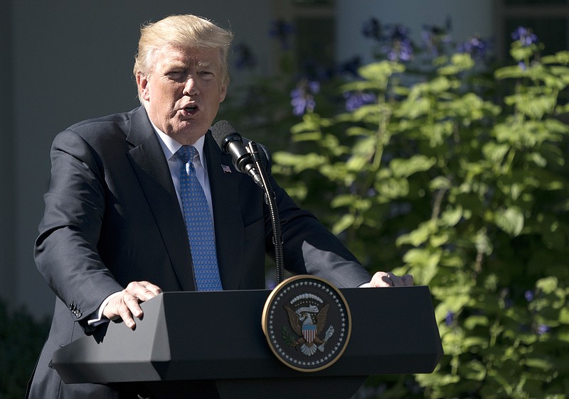 President Donald Trump speaks during anews conference with Greek Prime Minister Alexis Tsipras in the Rose Garden of the White House in Washington, Tuesday, Oct. 17, 2017. Trump on Tuesday will call the families of four soldiers killed this month in Niger, the White House says, as Trump again casts doubt on whether his predecessor appropriately consoled the families of military personnel who died in war. (AP Photo/Carolyn Kaster)