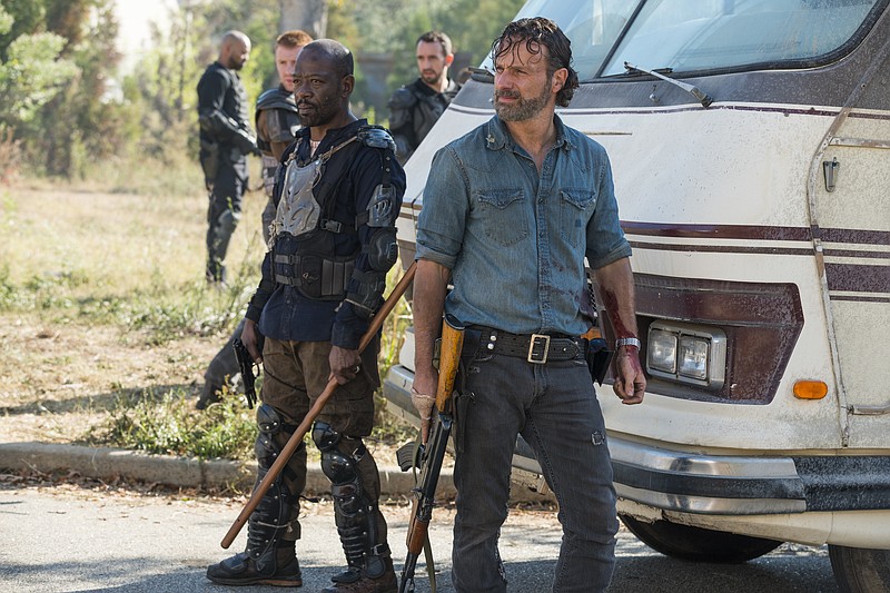 In this image released by AMC, Lennie James portrays Morgan Jones, left, and Andrew Lincoln portrays Rick Grimes in a scene from "The Walking Dead." The eighth season premieres on Oct. 22. (Gene Page/AMC via AP)