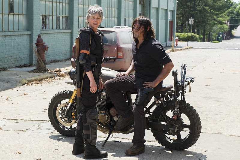 This image released by AMC shows Melissa McBride as Carol Peletier, left, and Norman Reedus as Daryl Dixon in a scene from "The Walking Dead."  The eighth season premieres on Oct. 22. (Gene Page/AMC via AP)