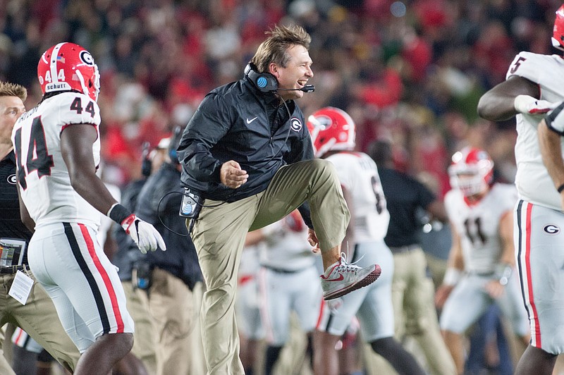 Georgia football coach Kirby Smart celebrates a late turnover by his defense during the 20-19 win at Notre Dame on Sept. 9.