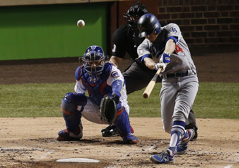 Los Angeles Dodgers' Enrique Hernandez (14) hits a home run off Chicago Cubs starting pitcher Jose Quintana during the second inning of Game 5 of baseball's National League Championship Series, Thursday, Oct. 19, 2017, in Chicago. (AP Photo/Charles Rex Arbogast)