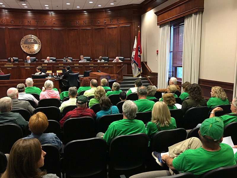 Harrison residents, many wearing green T-shirts proclaiming "Keep Harrison Beautiful," wait for the Hamilton County Commission's decision on a proposed construction and demolition landfill on Birchwood Pike.