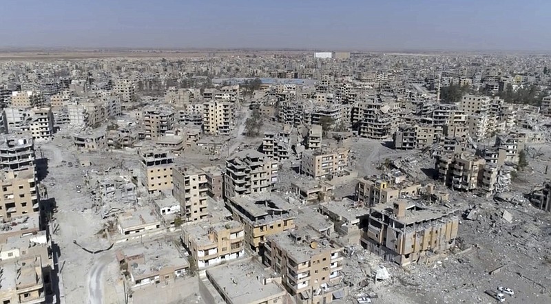 
              This Thursday, Oct. 19, 2017 frame grab made from drone video shows damaged buildings in Raqqa, Syria two days after Syrian Democratic Forces said that military operations to oust the Islamic State group have ended and that their fighters have taken full control of the city. (AP Photo/ Gabriel Chaim)
            