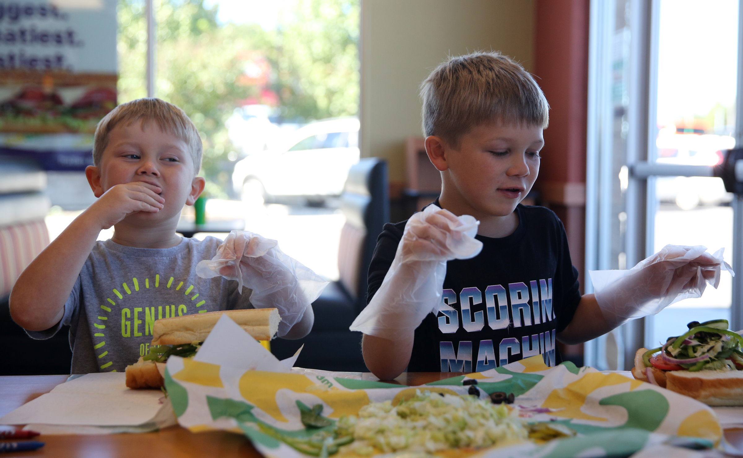 Owen Culberson, 4, and Noah Culberson, 7, of Ooltewah, Tenn., make sandwiches as a part of a Dynamic Dietetics workshop Monday, Oct. 16, 2017, at Subway in Cleveland, Tenn. Kids made Subway sandwiches as Dynamic Dietetics dietitians explained how to make better food choices to children and their parents attending the classes.