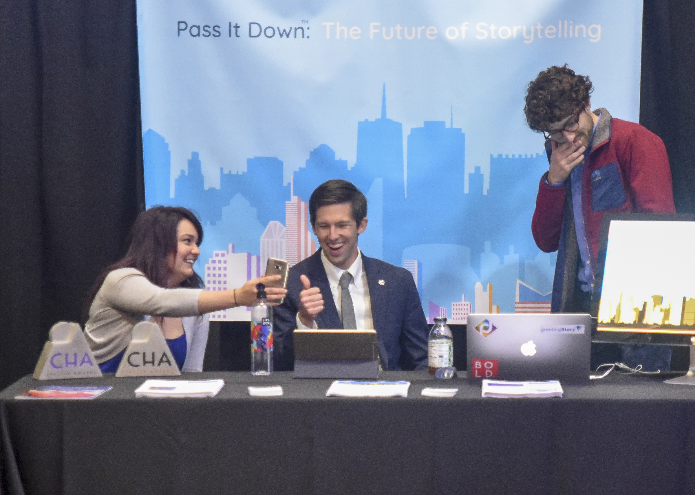 Chris Cummings, founder and CEO of Pass It Down, gives a thumbs up as Victoria Bruck, his marketing and social media specialist at the company booth Friday before the Spirit of Innovation Awards at the Chattanooga Convention Center.