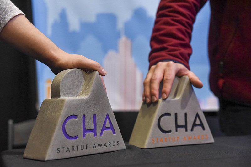 Chris Cummings, founder and CEO of Pass It Down, receives the Startup Award at the Spirit of Innovation Awards luncheon Friday at the Chattanooga Convention Center.