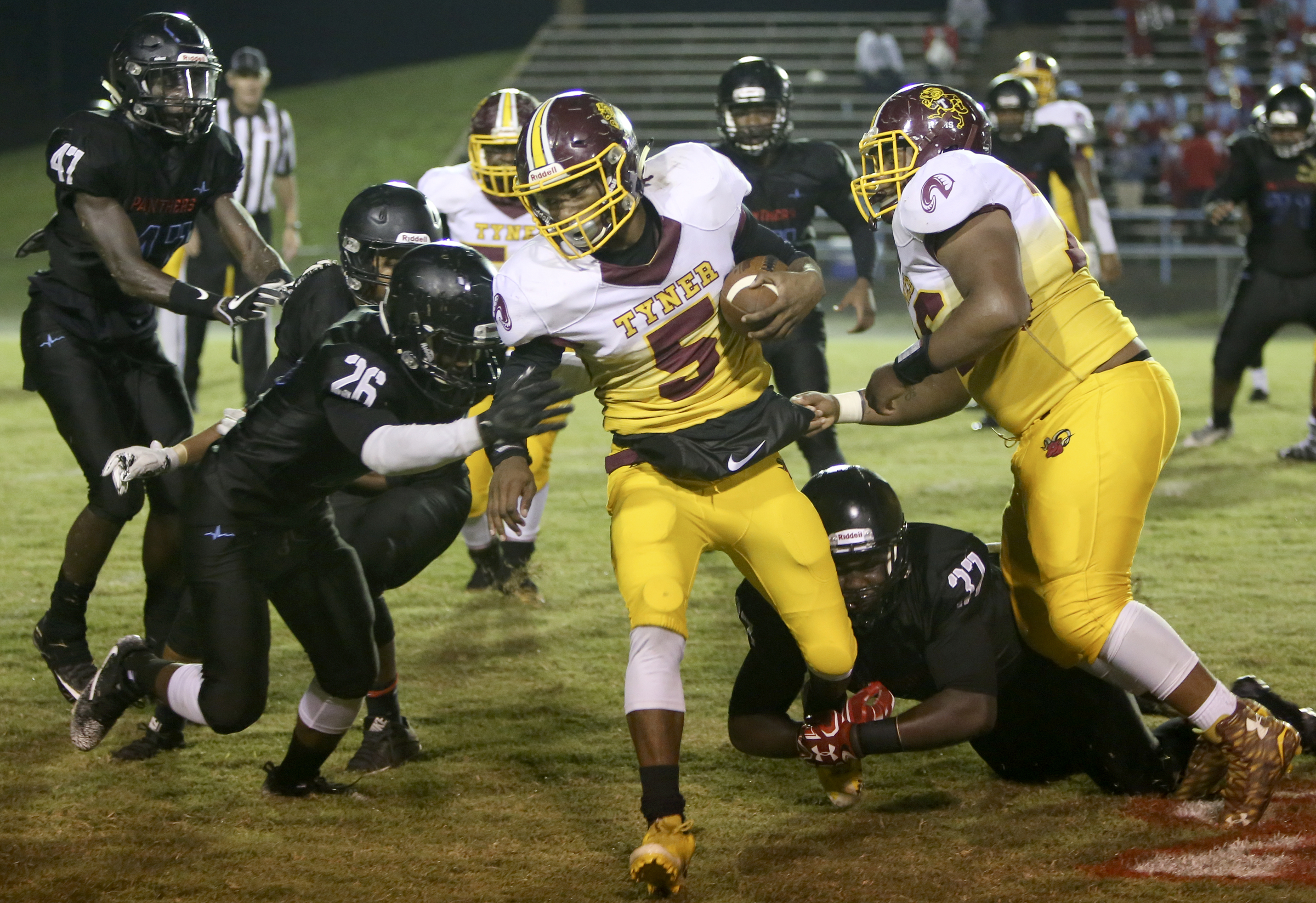 Brainerd's Demonte Pickett (26) and Ciante Chaney (37) work to stop Tyner's Keյn Webb (5) at Brainerd High School on Friday, Oct. 20, in Chattanooga, Tenn.