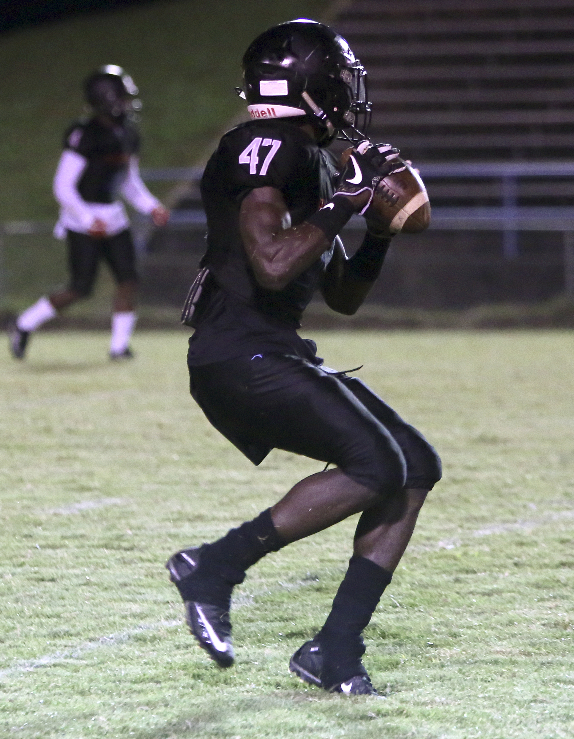 Brainerd's Joseph Norwood (47) looks to lateral the ball on a kickoff return against Tyner at Brainerd High School on Friday, Oct. 20, in Chattanooga, Tenn.