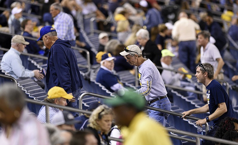 UTC fans file out of the stands during the third quarter of the Mocs game against Western Carolina at Finley Stadium on Saturday, Sept. 30, in Chattanooga, Tenn.