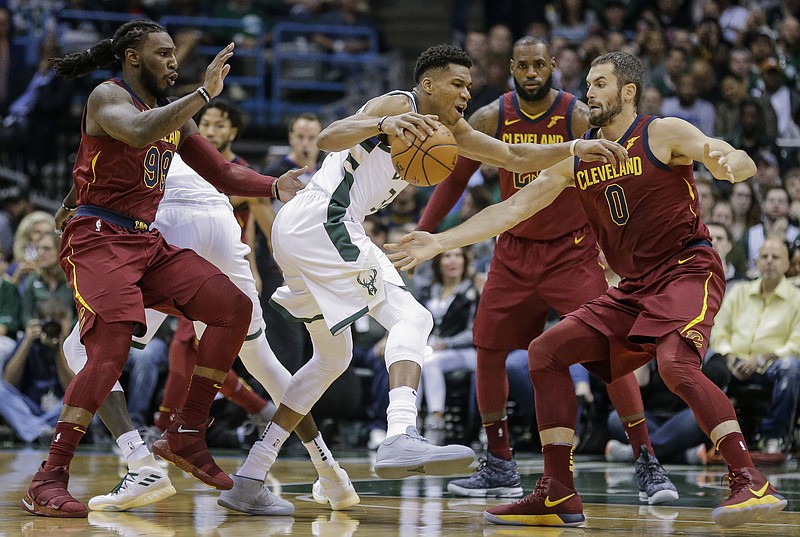 
              Milwaukee Bucks' Giannis Antetokounmpo tries to drive against the Cleveland Cavaliers defense during the first half of an NBA basketball game Friday, Oct. 20, 2017, in Milwaukee. (AP Photo/Tom Lynn)
            