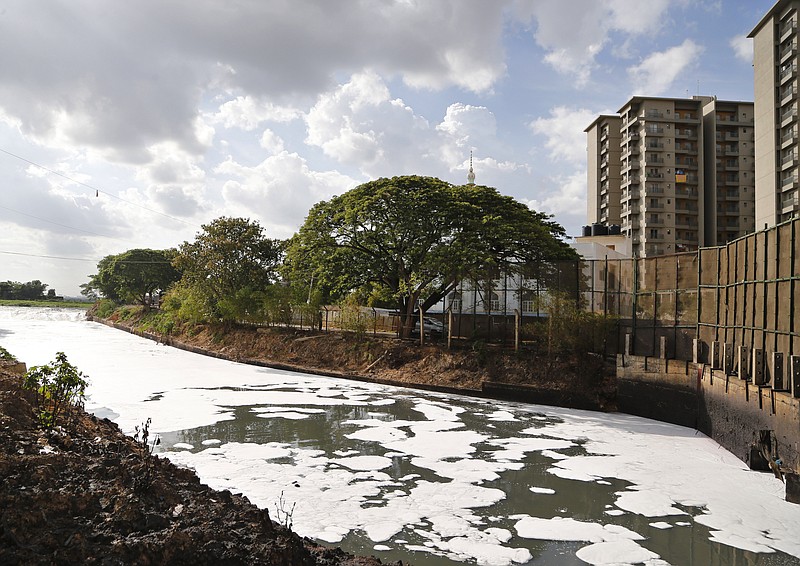 In this June 5, 2017, file photo, toxic froth from industrial pollution floats on Bellundur Lake on World Environment Day, in Bangalore, India. Environmental pollution - from filthy air to contaminated water - is killing more people every year than all war and violence in the world. (AP Photo/Aijaz Rahi, File)