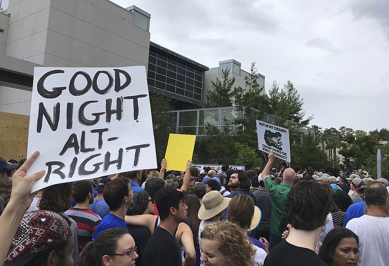 
              Protesters demonstrate ahead of white nationalist Richard Spencer's speech at the University of Florida, Thursday, Oct. 19, 2017, in Gainesville, Fla. Spencer's National Policy Institute is paying to rent space for the speaking event. (AP Photo/Jason Dearen)
            