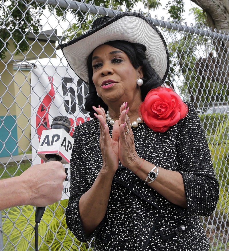 
              Rep. Frederica Wilson, D-Fla., talks to reporters, Wednesday, Oct. 18, 2017, in Miami Gardens, Fla. Wilson is standing by her statement that President Donald Trump told Myeshia Johnson, the widow of Sgt. La David Johnson killed in an ambush in Niger, that her husband "knew what he signed up for." In a Wednesday morning tweet, Trump said Wilson's description of the call was "fabricated." (AP Photo/Alan Diaz)
            
