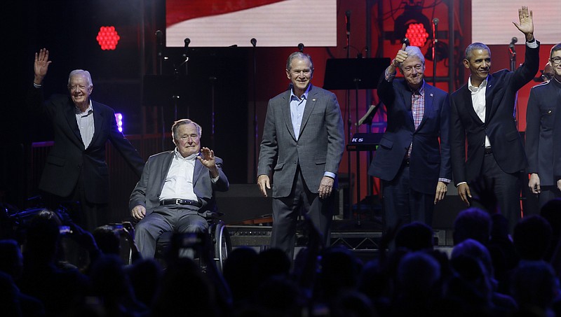 Former Presidents from right, Barack Obama, Bill Clinton, George W. Bush, George H.W. Bush and Jimmy Carter gather on stage at the opening of a hurricanes relief concert in College Station, Texas, Saturday, Oct. 21, 2017. All five living former U.S. presidents joined to support a Texas concert raising money for relief efforts from Hurricane Harvey, Irma and Maria's devastation in Texas, Florida, Puerto Rico and the U.S. Virgin Islands. (AP Photo/LM Otero)