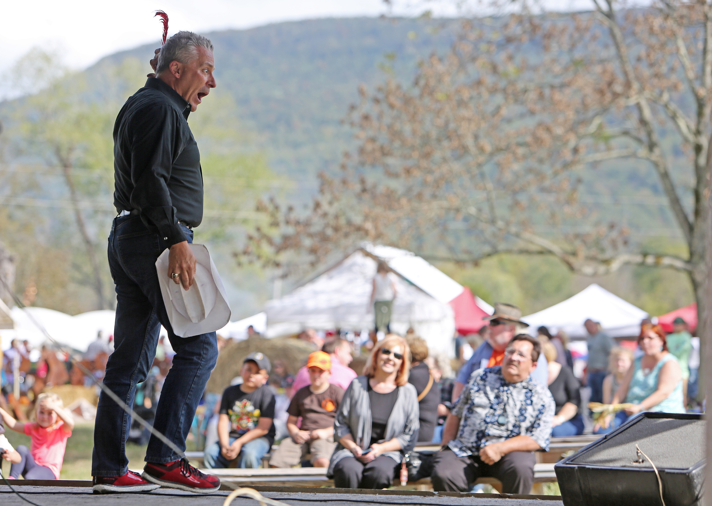 Ted Gocke performs a skit adapted to The Lone Ranger radio show in front of a crowd at the 40th annual Ketner's Mill Country Arts Fair in Whitwell, Tenn., Sunday, Oct. 22, 2017. Each year more than 150 artisans show off their work through products and demonstrations at the festival. The fair was established in 1977 to help preserve the mill. Crafts at the fair range from metal art and jewelry to woven baskets and furniture.