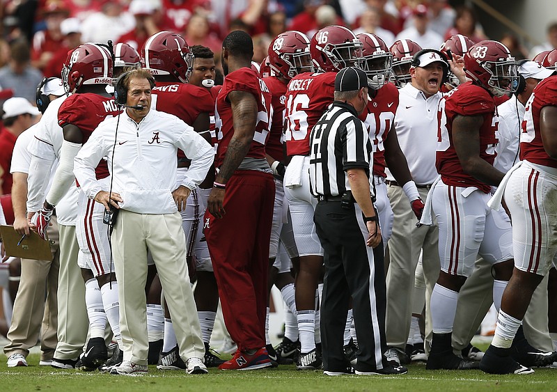 Alabama head coach Nick Saban stands in the huddle during the first half an NCAA college football game, Saturday, Oct. 21, 2017, in Tuscaloosa, Ala. (AP Photo/Brynn Anderson)