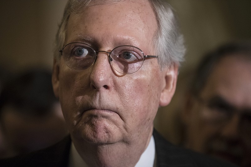 FILE - In this Tuesday, Sept. 26, 2017, file photo, Senate Majority Leader Mitch McConnell, R-Ky., listens to remarks during a news conference at the Capitol in Washington. McConnell said Sunday, Oct. 22, he’s willing to bring bipartisan health care legislation to the floor if President Donald Trump makes clear he supports it. (AP Photo/J. Scott Applewhite, File)