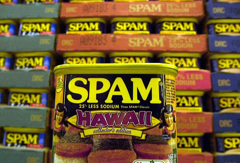 FILE - This March 3, 2004 file photo shows a collector's limited edition "Hawaii" can of Spam, with a hula doll on both sides of the can and a picture of three pieces of spam musubi in Kailua, Hawaii. Cans of Spam have become a common item that's being stolen from Honolulu stores and then sold on the streets for quick cash, according to authorities. The state's love affair with Spam began during World War II, when rationing created just the right conditions for the rise of a meat that needs no refrigeration and has a remarkably long shelf life (indefinitely, the company says). (AP Photo/Lucy Pemoni, File)

