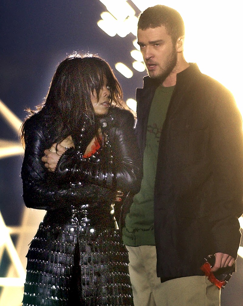 FILE - In this Feb. 1, 2004, file photo, singer Janet Jackson covers her breast as Justin Timberlake holds part of her costume after her outfit came undone during the halftime show of Super Bowl XXXVIII in Houston. The NFL announced Sunday, Oct. 22, 2017, that Timberlake will headline the Super Bowl halftime show Feb. 4 in Minnesota, 14 years after the "wardrobe malfunction" with Janet Jackson cause a national controversy. (AP Photo/Elise Amendola, File)

