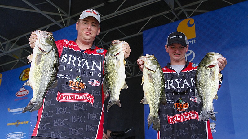 Jake Lee and Jacob Foutz hold up the bass that helped propel them to the top of the weight leaderboards at the 2017 Carhartt Bassmaster College Series National Championship.