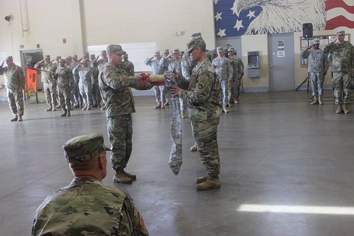 Command Sgt. Maj. Michael Warren, left, and Lt. Col. Brooke Grubb, Battalion Commander, prepare the 30th Combat Sustainment Support Battalion colors for casing prior to their deployment to Afghanistan during a ceremony on Oct. 21, 2017 in Humboldt, Tenn.  More than 30 personnel will provide logistical combat support to U.S. Forces in support of Operation Freedom’s Sentinel.