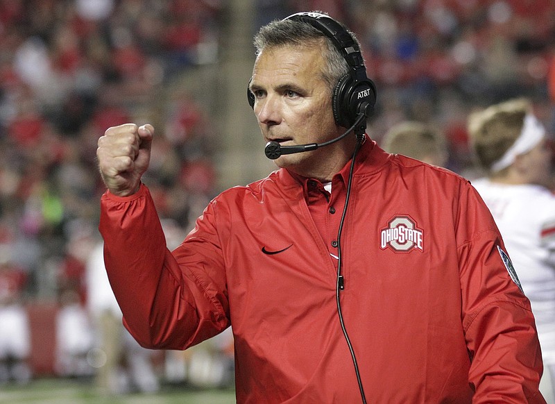 
              FILE - In this Sept. 30, 2017, file photo, Ohio State head coach Urban Meyer reacts to play during an NCAA college football game against Rutgers in Piscataway, N.J. Meyer says he likes the progress of the Buckeyes’ offense in the past month. He says quarterback J.T. Barrett and the passing game is clicking with Penn State and other tougher games looming after the bye week. (AP Photo/Mel Evans, File)
            