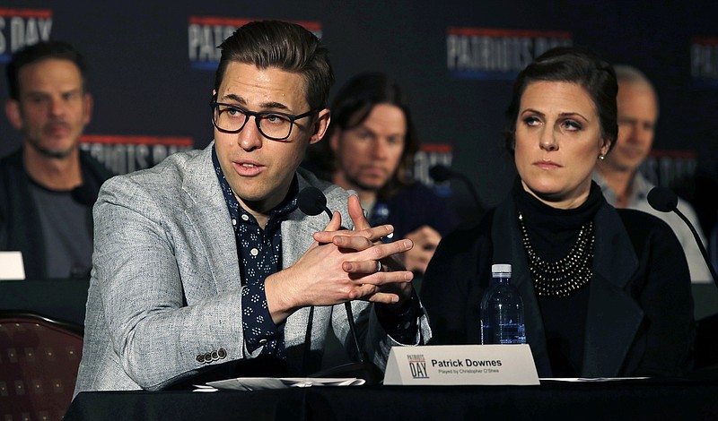 FILE- In this Dec. 15, 2016, photo, Boston Marathon bombing survivors Patrick Downes, left, and his wife Jessica Kensky address reporters in Boston, during a press availability for "Patriots Day," a movie based on the bombing. Downes and Kensky are awarding a scholarship to a college sophomore who lost a leg to cancer as a child. Jack Manning, of Norfolk, Mass., is the inaugural winner of the "Boston College Strong" scholarship being presented Monday, Oct. 23, 2017. (AP Photo/Charles Krupa, File)


