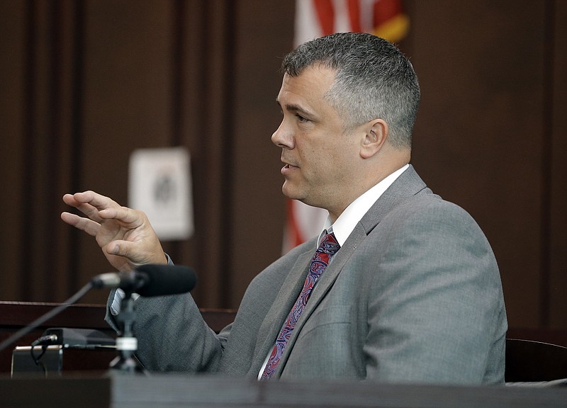 Nashville Police Detective Steve Jolley testifies during a preliminary hearing for Emanuel Kidega Samson in general sessions court Monday, Oct. 23, 2017, in Nashville, Tenn. Samson is accused of fatally shooting one person and wounding others at a Tennessee church on September. Jolley said Samson told him he heard voices and had visions. Jolley also testified about a note in Samson's car that referenced a white supremacist's 2015 massacre at a South Carolina black church. The case against Samson was bound over to a grand jury. Samson did not appear at the hearing. (AP Photo/Mark Humphrey)

