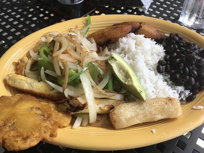 The Pacifica platter at Conga Latin Food is a big meal with big flavors. It features fish covered in sauteed onions and green peppers, sweet plantains, fried yucca and white rice with black beans.