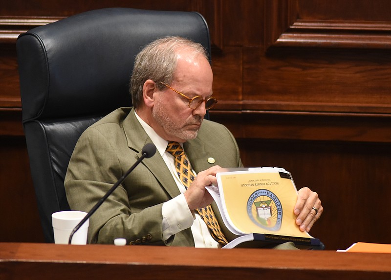 Commissioner Tim Boyd studies school budget documents during a 2015 Hamilton County Commission meeting.