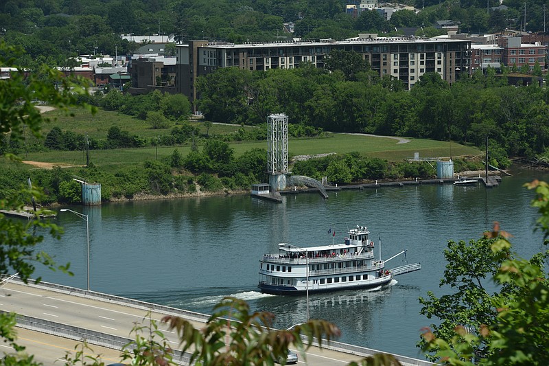The Southern Belle riverboat moves upstream on the Tennessee River in this view of the land behind the former Casey barge that can now be seen by Chattanoogans. 