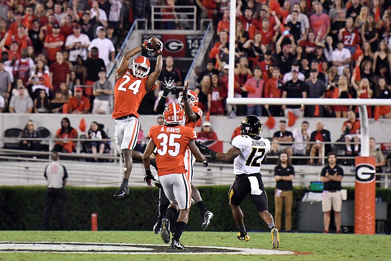 Georgia safety Dominick Sanders (24) had this interception in the 53-28 win over Missouri on Oct. 14, but the Bulldogs also allowed four touchdown passes, including two from 63 yards out.