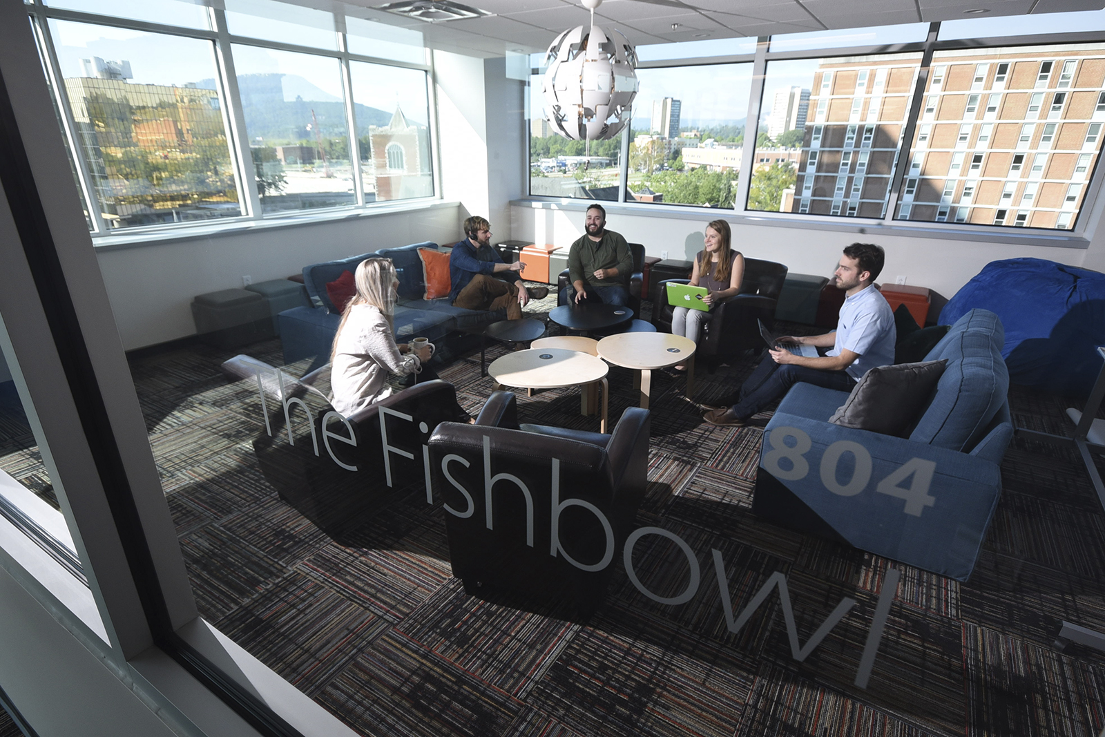 Skuid software sales and marketing personnel meet in a corner room called The Fishbowl in some of the most modern workspaces in Chattanooga.