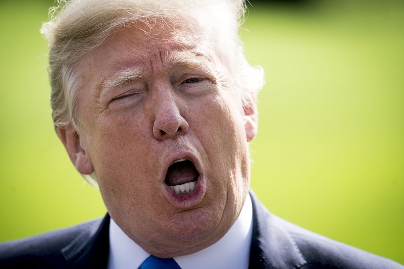 President Donald Trump speaks to reporters outside the White House in Washington on Wednesday. 