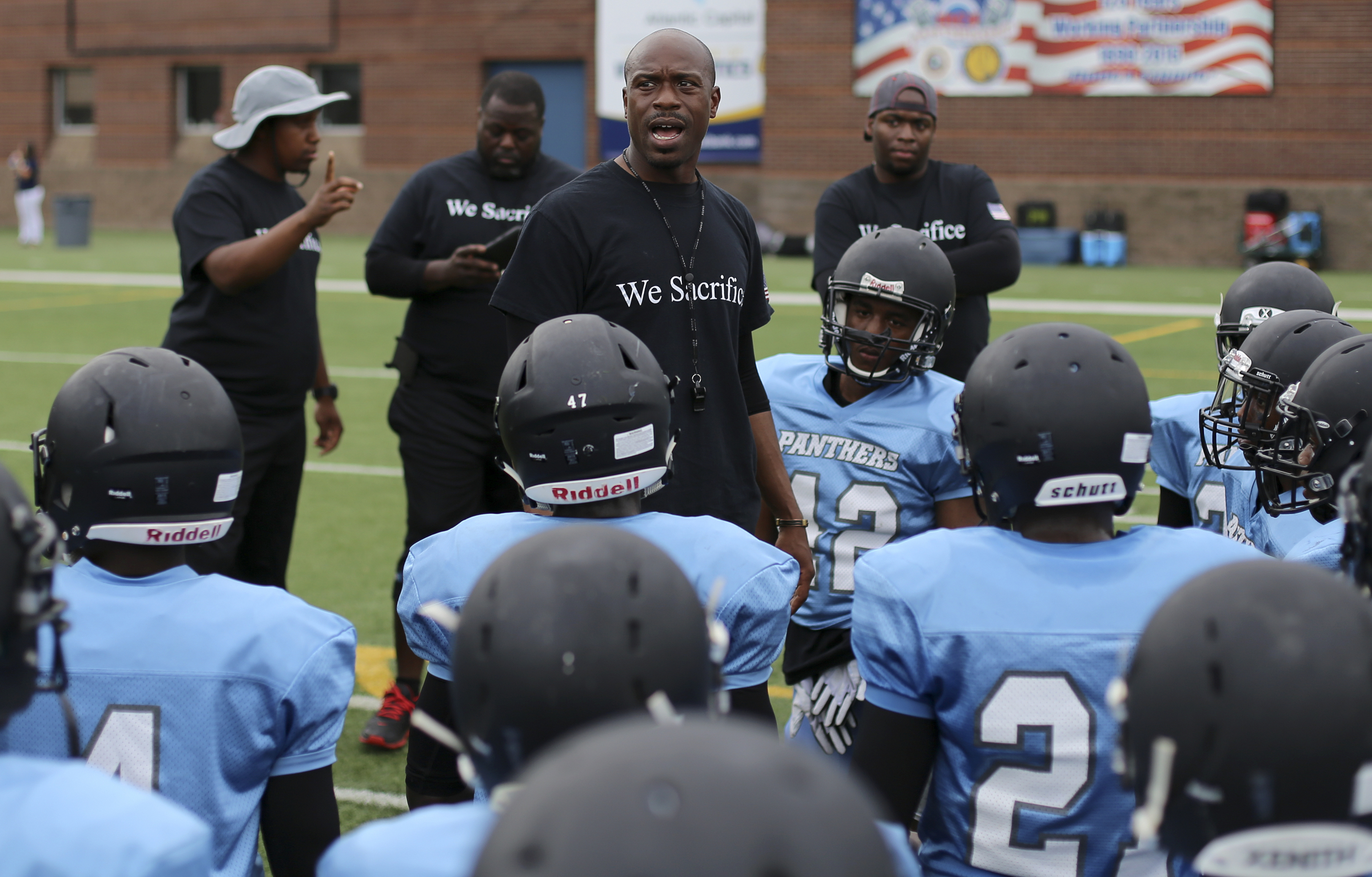 Brainerd head coach Tyrus Ward talks to his team before they play in the Kickoff Classic Best of Preps jamboree at Finley Stadium on Friday, Aug. 11, in Chattanooga, Tenn.