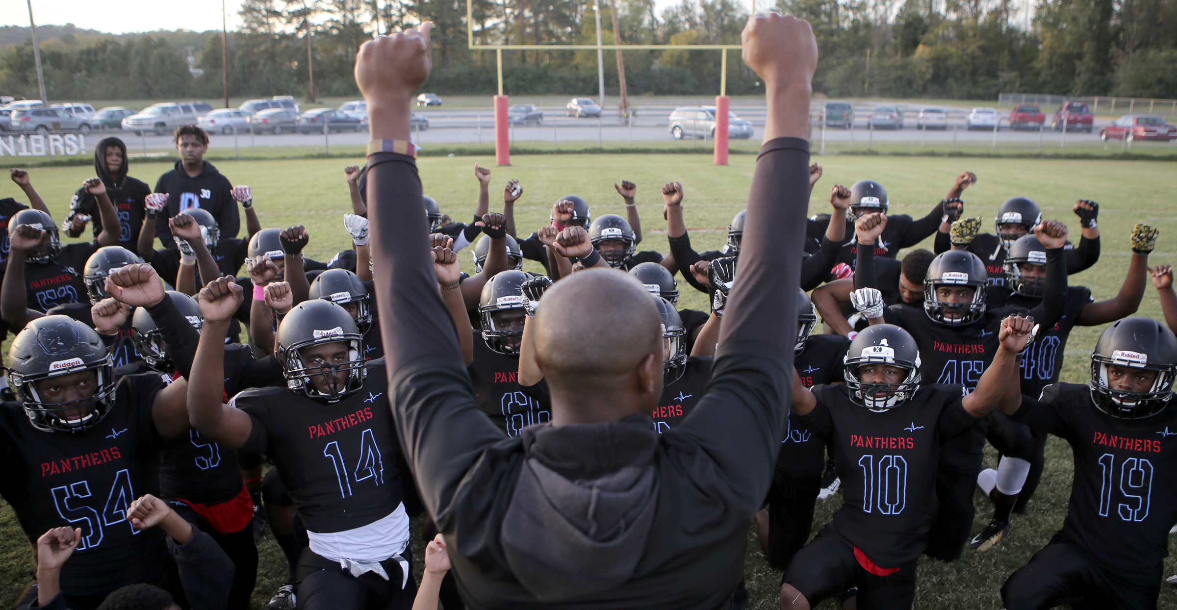 The Brainerd Panthers follow head coach Tyrus Ward's lead as he gets them psyched up for their game against Tyner at Brainerd High School on Friday, Oct. 20, in Chattanooga, Tenn.