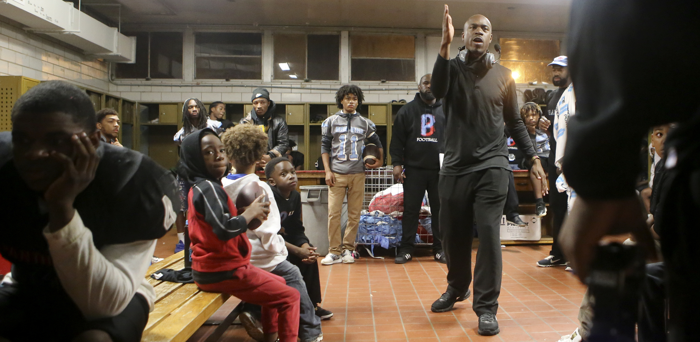 Brainerd head coach Tyrus Ward, right, talks to his team during halftime of their game against Tyner in the locker room at Brainerd High School on Friday, Oct. 20, in Chattanooga, Tenn.
