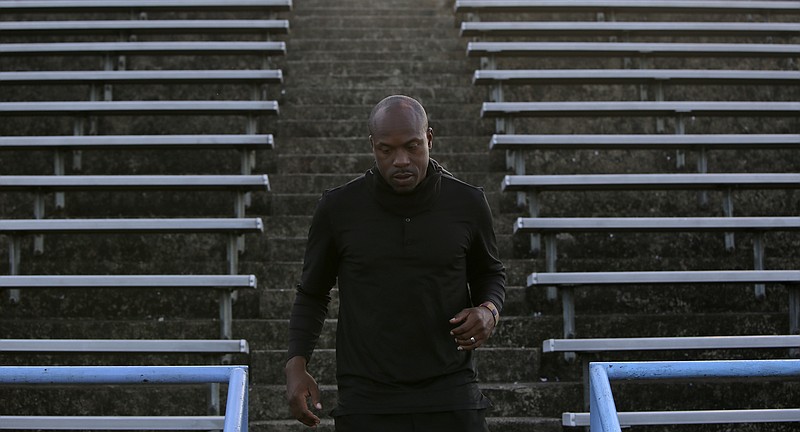 Brainerd coach Tyrus Ward makes his way down the stadium steps before a home game against Tyner this past Friday. Ward's first season leading the football program at his alma mater has included only one win, but there are other signs of progress for the Panthers, both on and off the field.