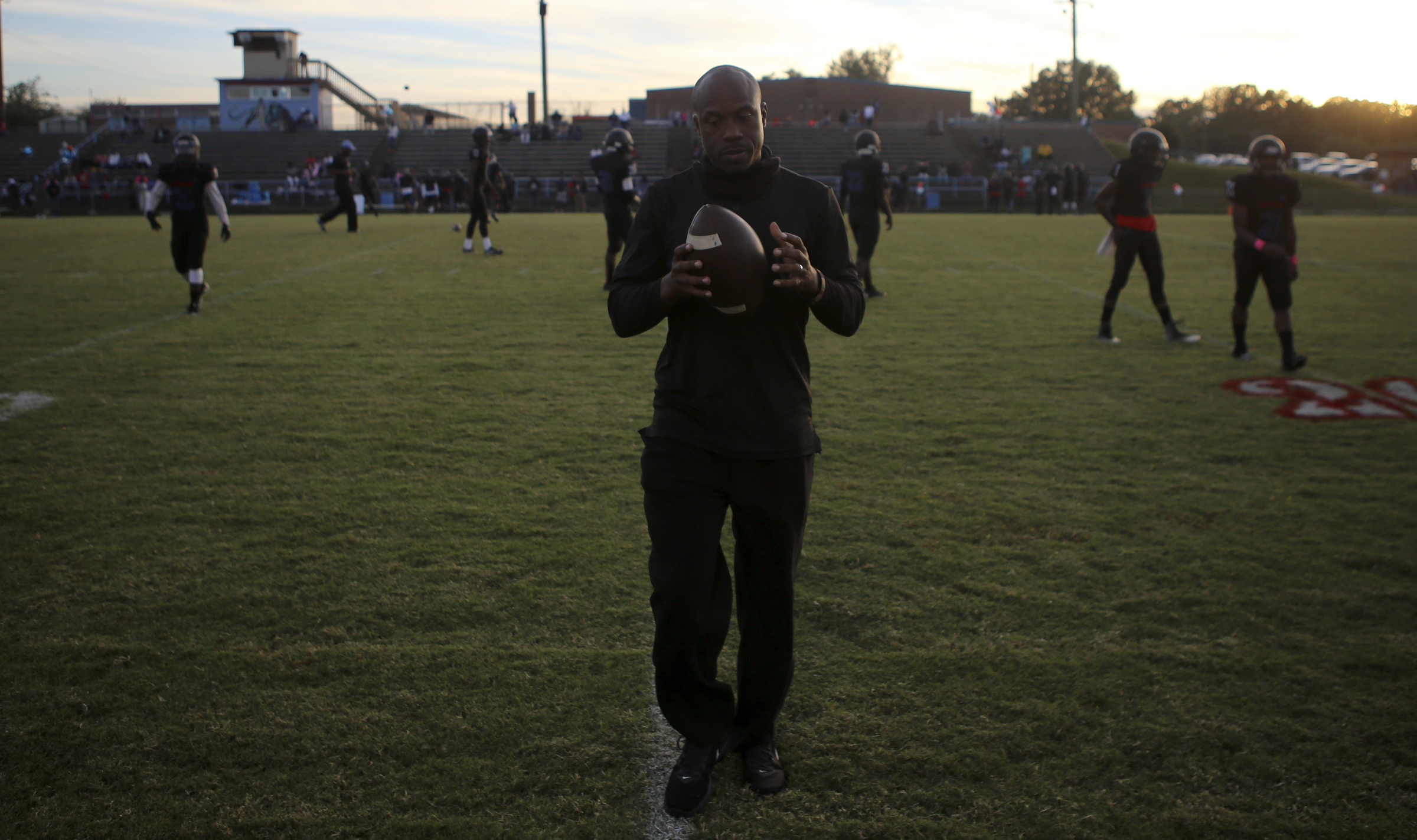 Brainerd head coach Tyrus Ward runs some of his players through a drill before their game against Tyner at Brainerd High School on Friday, Oct. 20, in Chattanooga, Tenn.