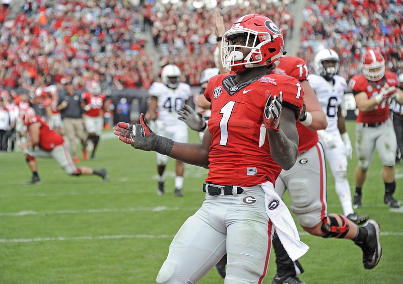 Georgia tailback Sony Michel celebrates a touchdown during the Bulldogs' 24-17 win over Penn State in the TaxSlayer Bowl after the 2015 season. The Bulldogs have won just once in their past five trips to Jacksonville, Fla., entering Saturday's game against Florida.