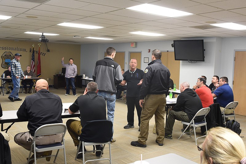 Crisis Intervention Team engage in role play Friday morning in the Chattanooga Police Department's  community room inside the Police Service Center on Amnicola.