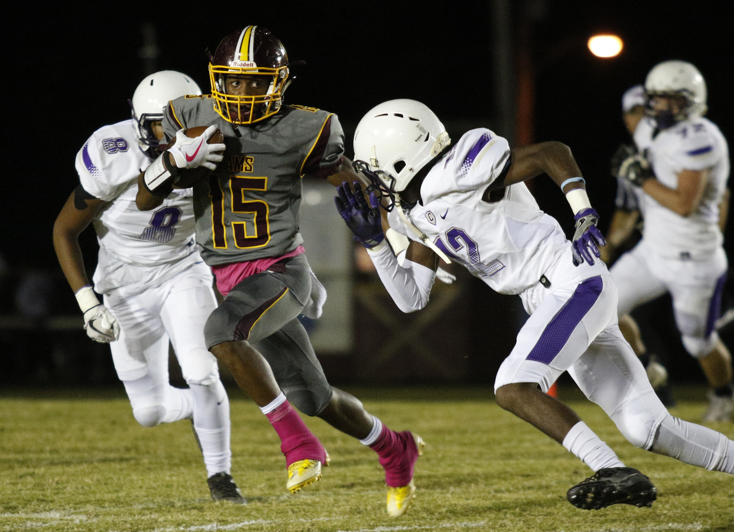 Tynerճ Rahle High (15) takes off ahead of Centralճ Tracy Odom (12) and Centralճ Jaren Wilcoxson (8) during their prep football game at Tyner High School on Friday, Oct. 27, 2017, in Chattanooga, Tenn.