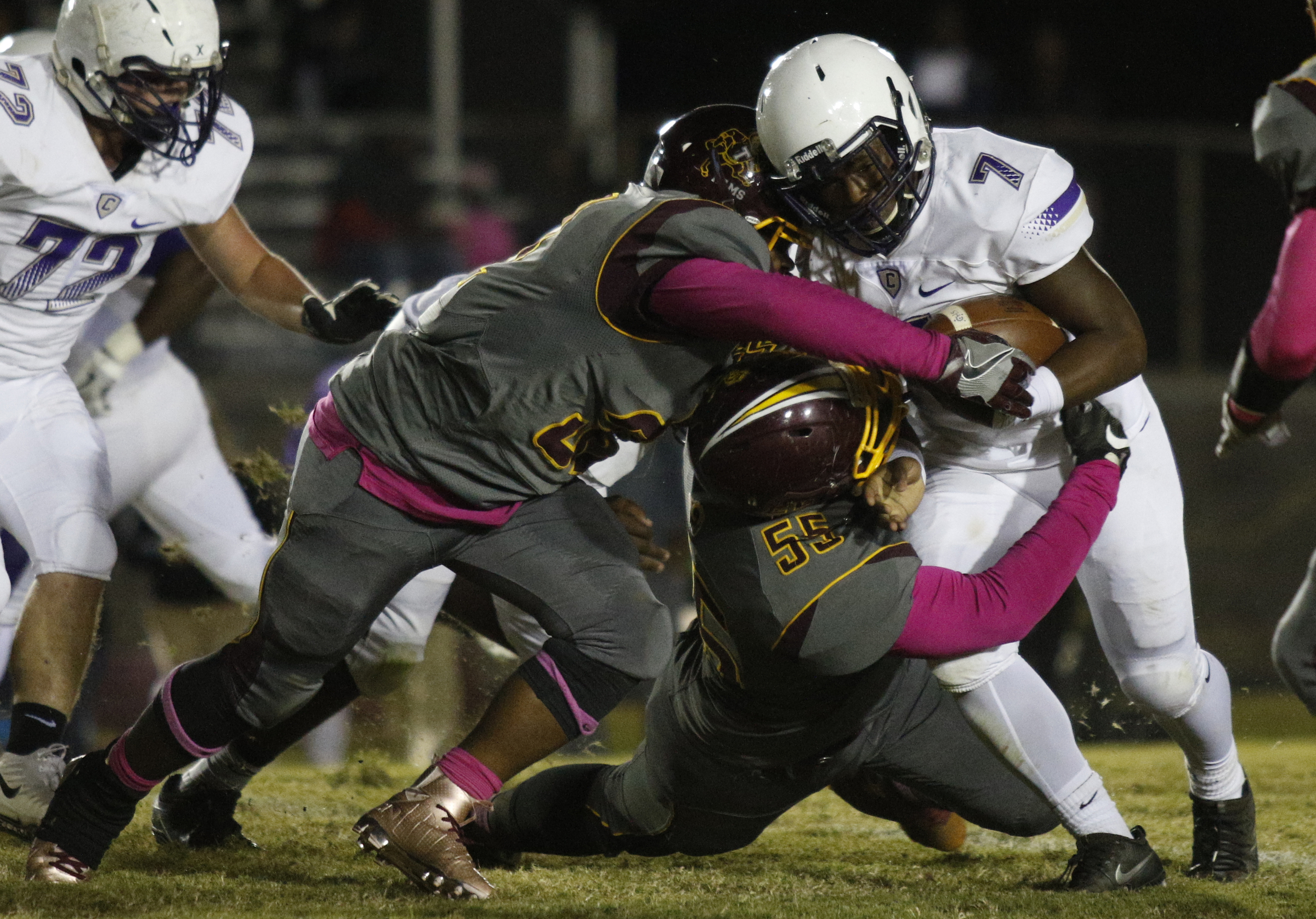 Centralճ Jaheim Jones (7) pushes into Tynerճ Deandre Williams (55) and Tynerճ Kamden Edwards during their prep football game at Tyner High School on Friday, Oct. 27, 2017, in Chattanooga, Tenn.