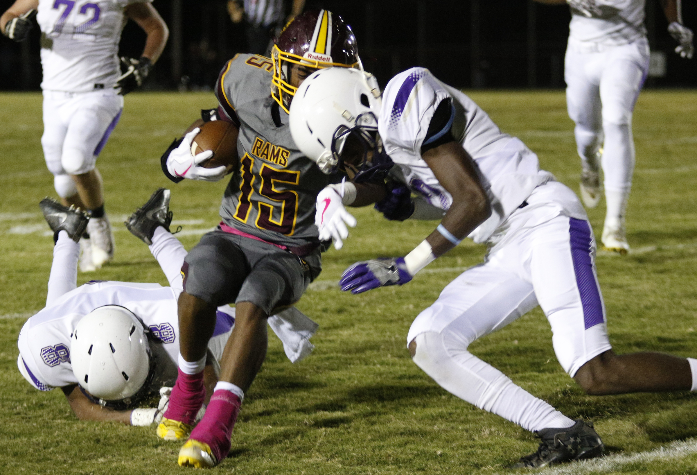 Centralճ Tracy Odom (12) and Centralճ Jaren Wilcoxson (8) tackle Tynerճ Rahle High (15) during their prep football game at Tyner High School on Friday, Oct. 27, 2017, in Chattanooga, Tenn.