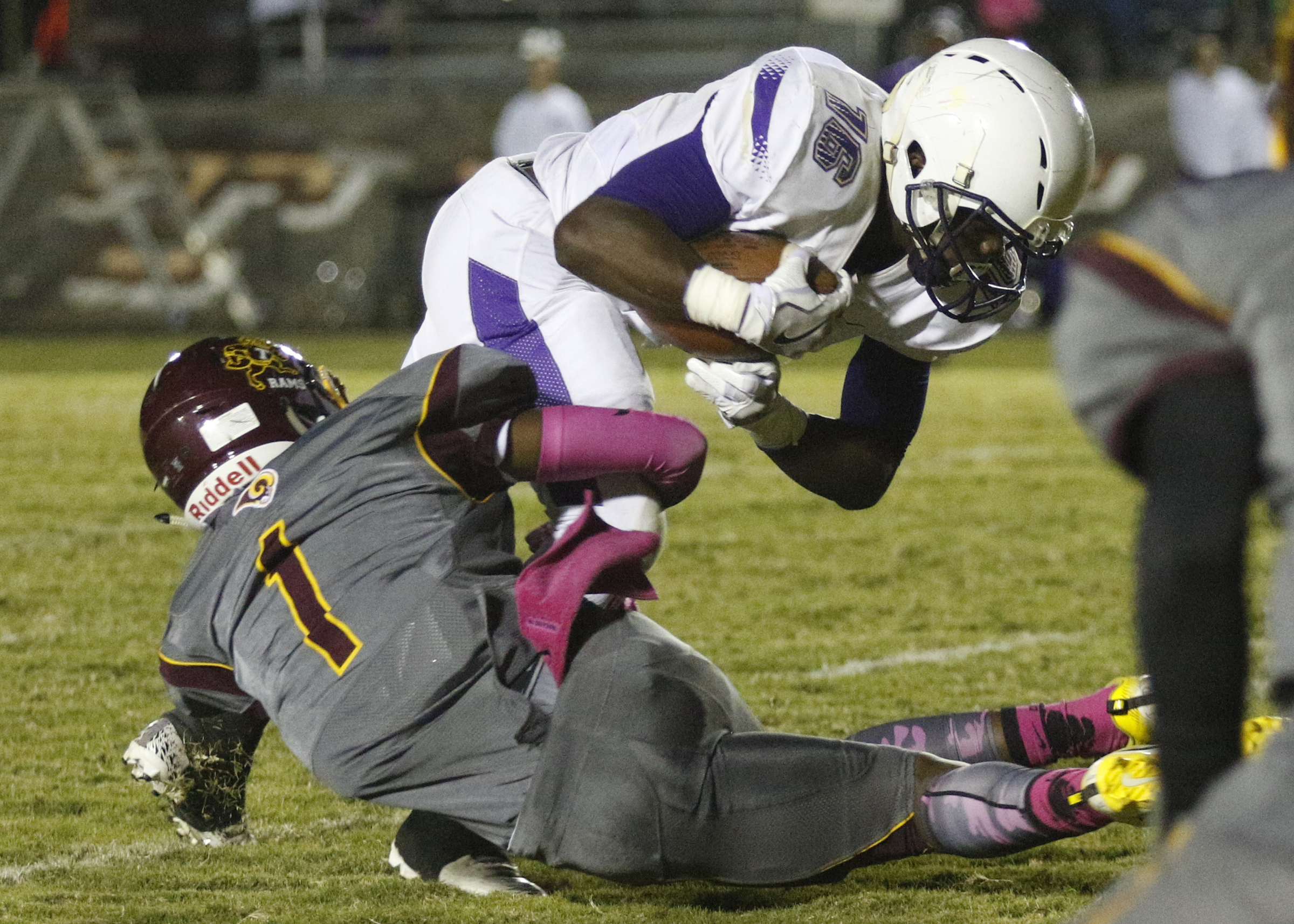 Tynerճ Martavius Ryals (1) tackles Centralճ Michael McGhee (16) during their prep football game at Tyner High School on Friday, Oct. 27, 2017, in Chattanooga, Tenn.