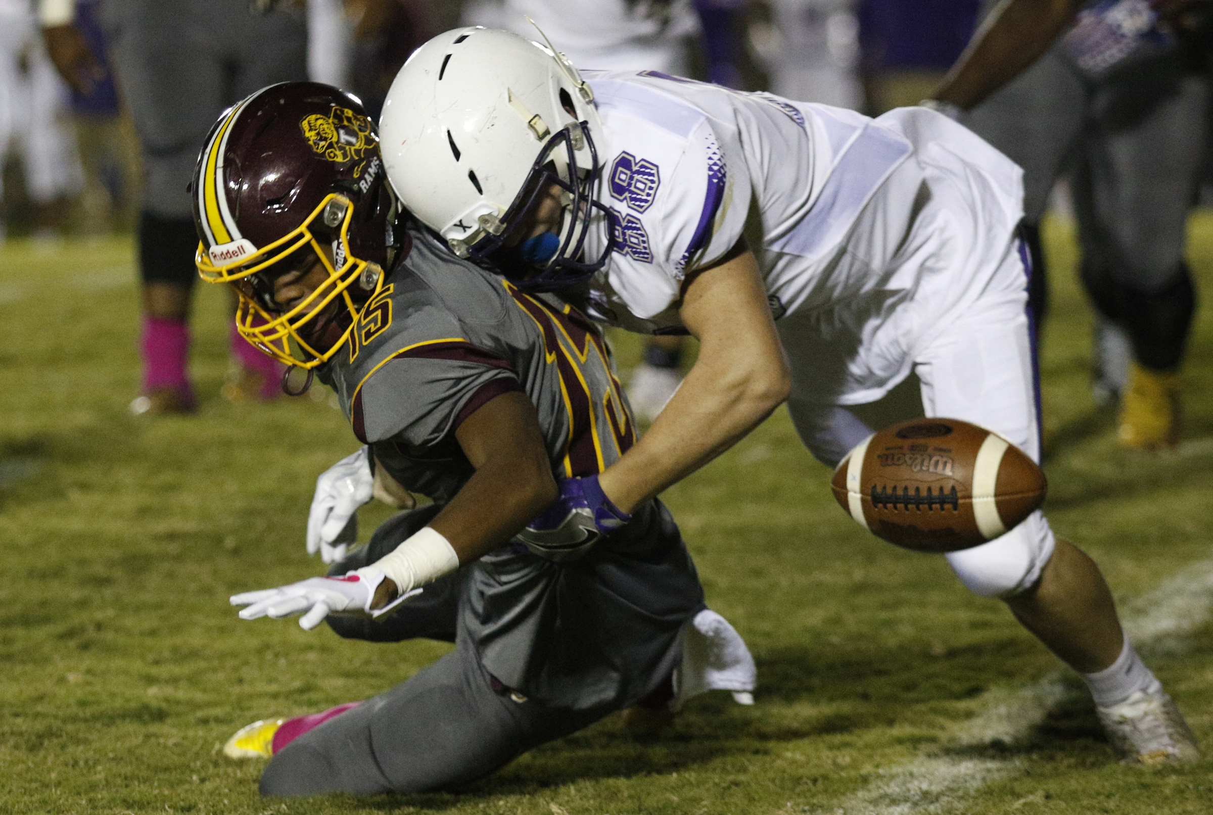 Centralճ Jaren Wilcoxson (8) forces a fumble as he tackles Tynerճ Rahle High (15) during their prep football game at Tyner High School on Friday, Oct. 27, 2017, in Chattanooga, Tenn.