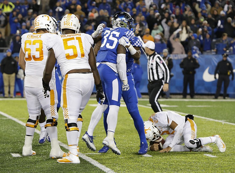 Kentucky defensive end Denzil Ware (35) celebrates after sacking Tennessee quarterback Jarrett Guarantano in the final seconds of the second half of Saturday's game in Lexington. The host Wildcats won 29-26.