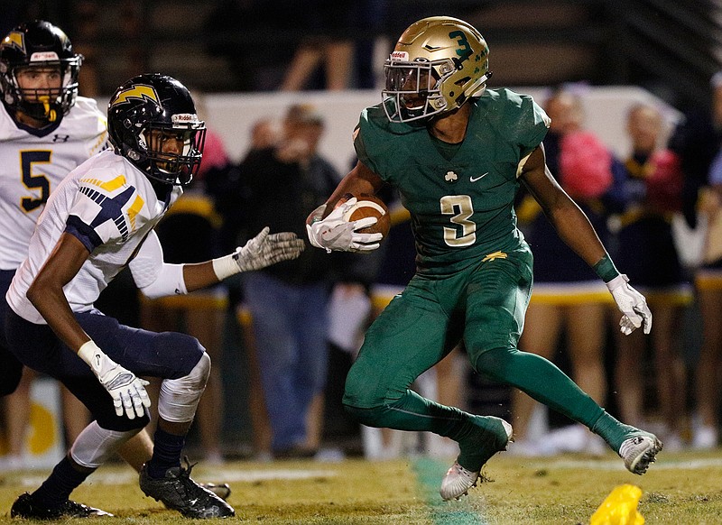 Notre Dame's Cameron Wynn, with ball, breaks around Chattanooga Christian's Christian Fallins during a game on Oct. 20. Notre Dame won 39-15 to complete an 8-1 regular season, and the Fighting Irish are the No. 1 seed in Division II-AA entering the TSSAA playoffs, which will begin Friday.