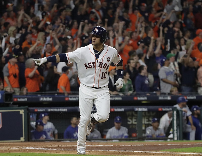 Houston Astros' Yuli Gurriel reacts after hitting a home run during the first inning of Game 3 of baseball's World Series against the Los Angeles Dodgers Friday, Oct. 27, 2017, in Houston. (AP Photo/David J. Phillip)